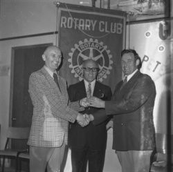Rotary Club of Nakusp meeting, February 1972. Len Folkman at left; Glenn Weatherhead at centre; new president Rex Thorp at right